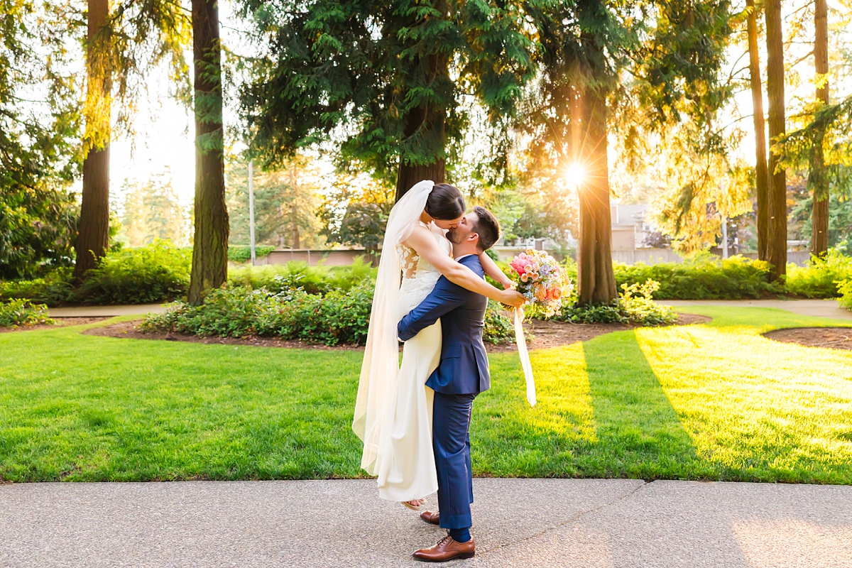 Bride and groom embracing during their Robinswood House wedding in Bellevue on a sunny summer day