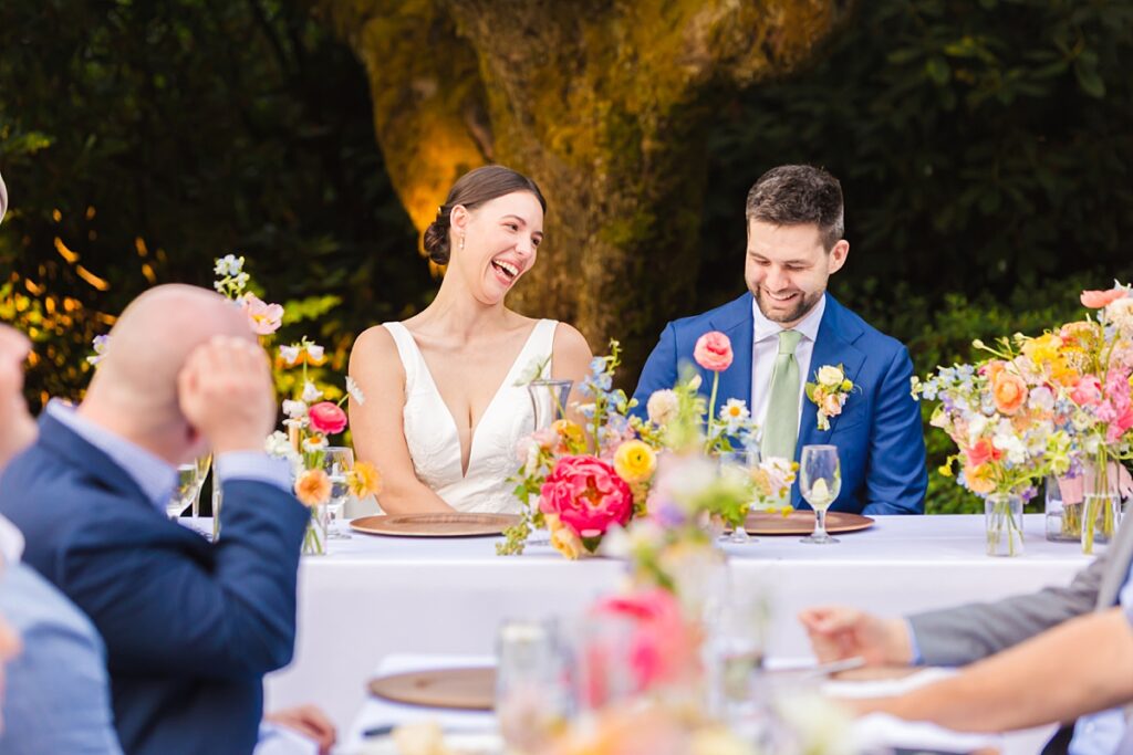 Bride and groom embracing during their Robinswood House wedding in Bellevue on a sunny summer day