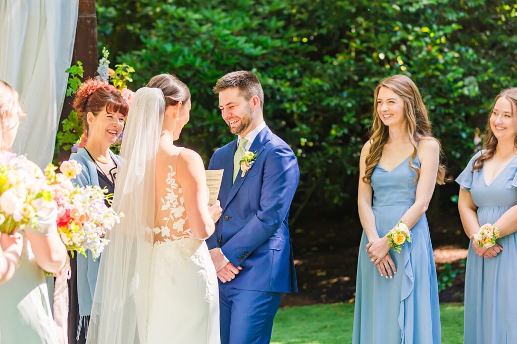 Bride and groom embracing during their Robinswood House wedding in Bellevue on a sunny summer day