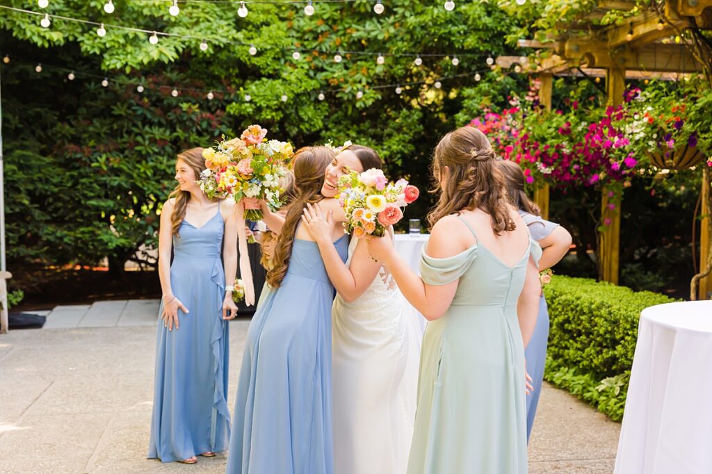 Bride and groom embracing during their Robinswood House wedding in Bellevue on a sunny summer day