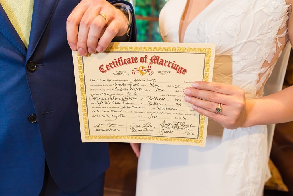 Bride and groom embracing during their Robinswood House wedding in Bellevue on a sunny summer day