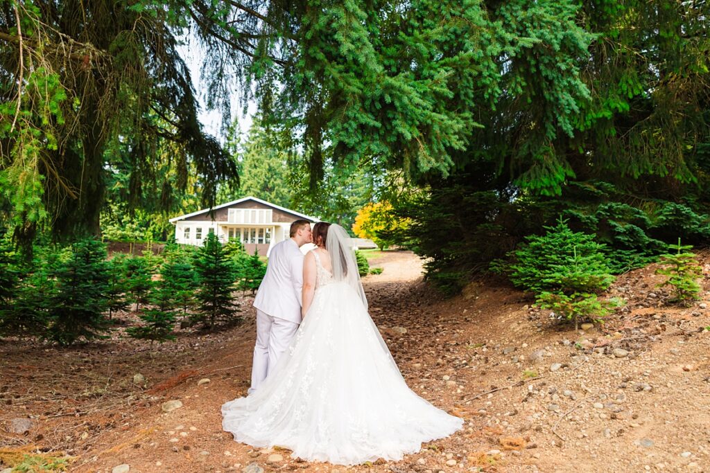 Jade and Sam smiling during their same-sex wedding at Trinity Tree Farm in Issaquah