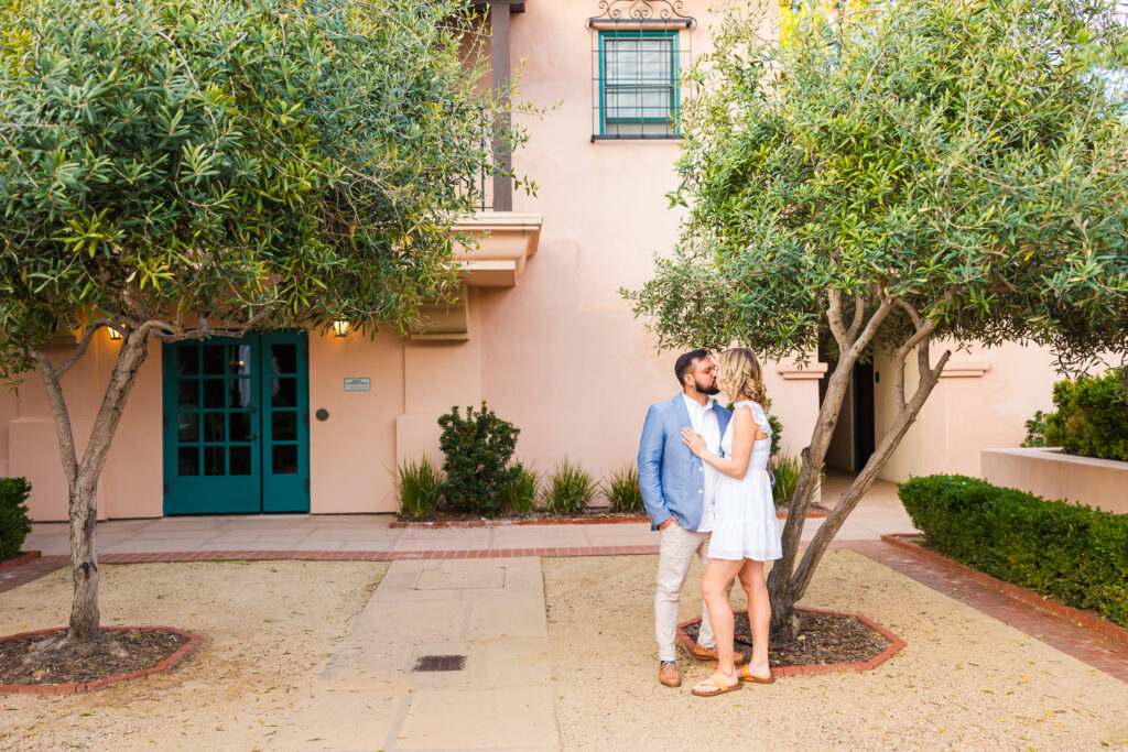 Victoria and Jonathan beneath the banyan tree during their Music Academy of the West engagement photos in Santa Barbara.