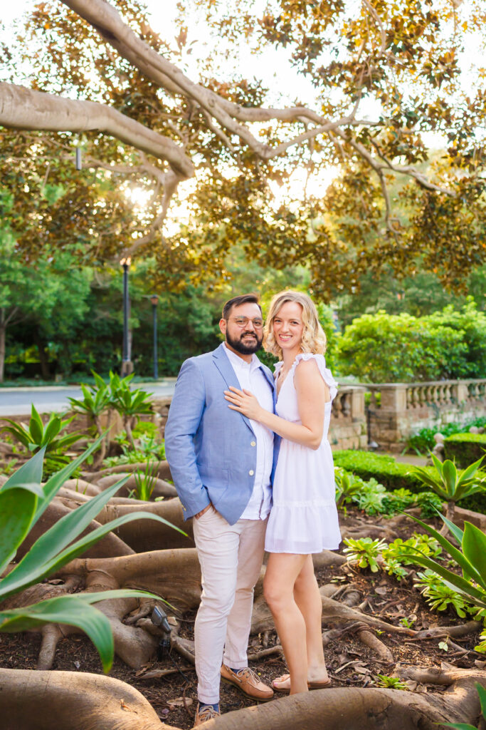 Victoria and Jonathan beneath the banyan tree during their Music Academy of the West engagement photos in Santa Barbara.