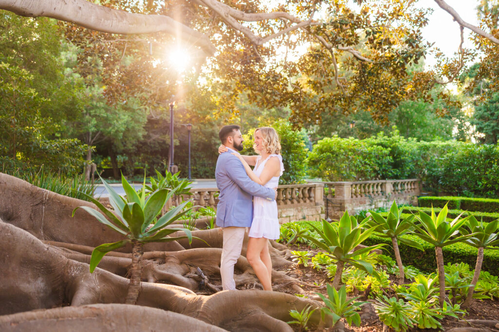 Victoria and Jonathan beneath the banyan tree during their Music Academy of the West engagement photos in Santa Barbara.