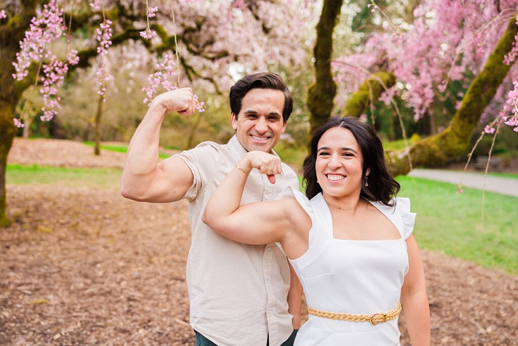 Seattle engagement photos at Washington Park Arboretum with cherry blossoms and couple embracing