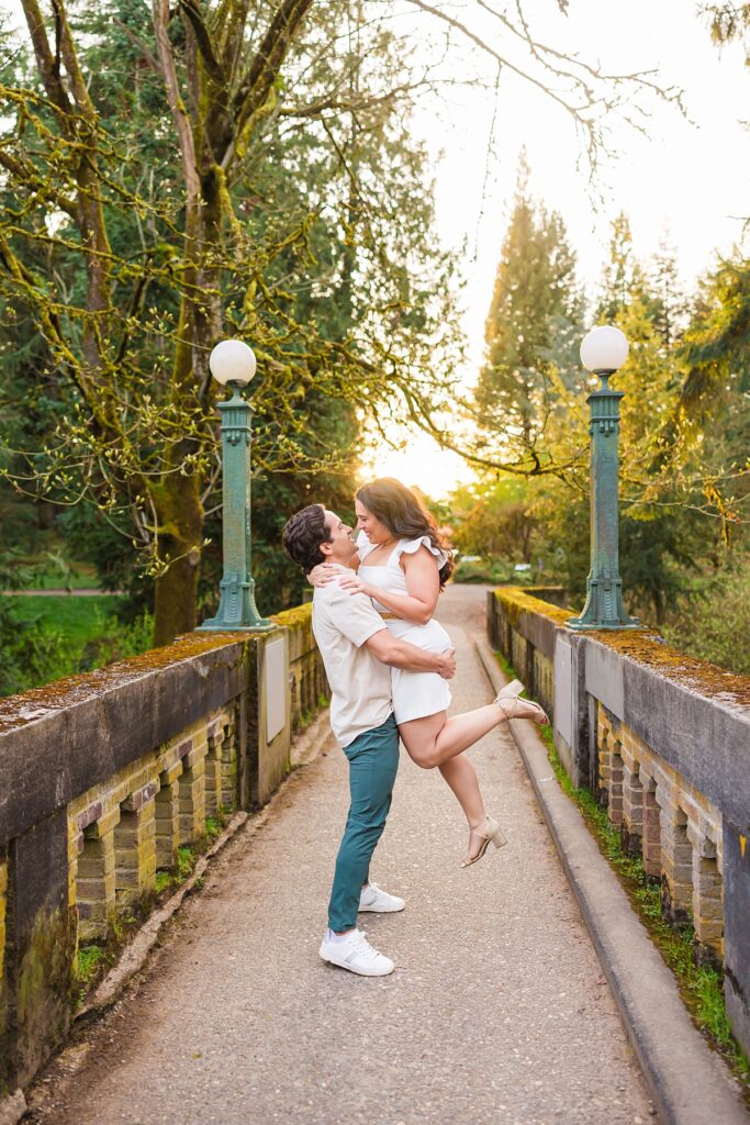 Seattle engagement photos at Washington Park Arboretum with cherry blossoms and couple embracing
