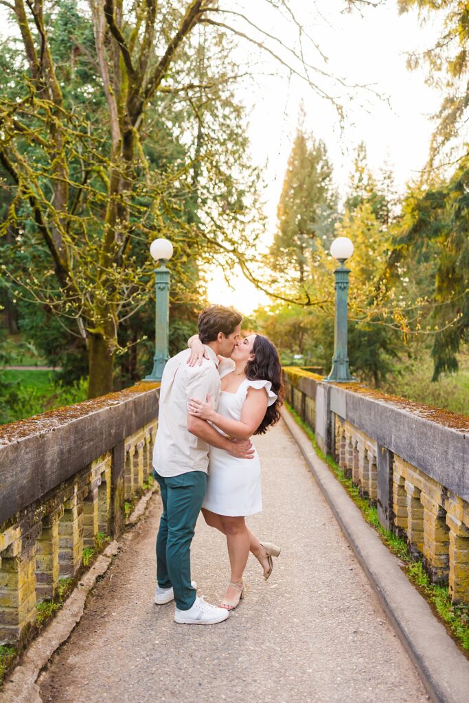 Seattle engagement photos at Washington Park Arboretum with cherry blossoms and couple embracing