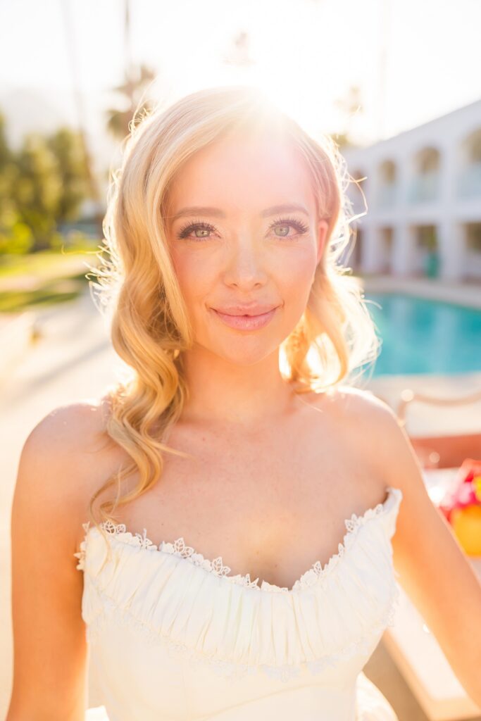 Bride and groom dancing beside a colorful poolside reception at Casa Palma in Palm Springs
