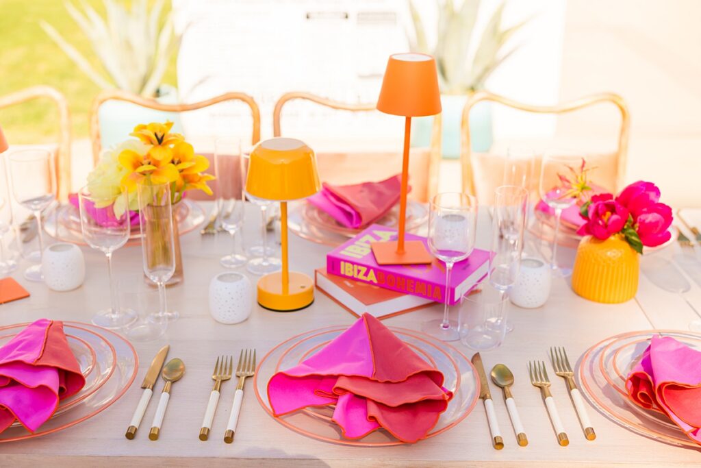 Colorful poolside reception table design at Casa Palma in Palm Springs with vibrant florals and pink details