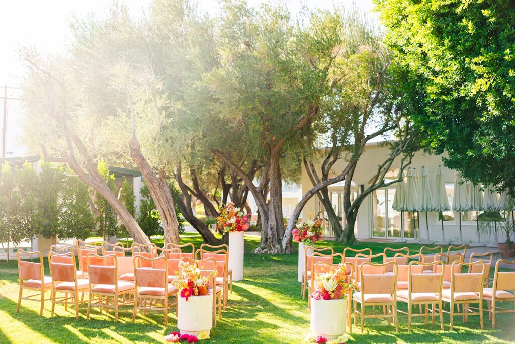 Outdoor wedding ceremony setup at Casa Palma in Palm Springs with colorful florals and garden view